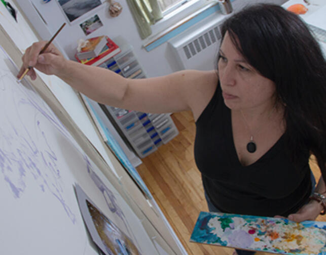 Portrait photograph of artist Josie Gonzalez in her art studio Detail photograph of artist Josie Gonzalez holding paint palette in her studio